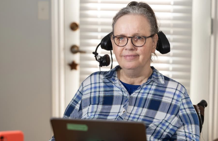 a quadriplegic woman wearing a headset