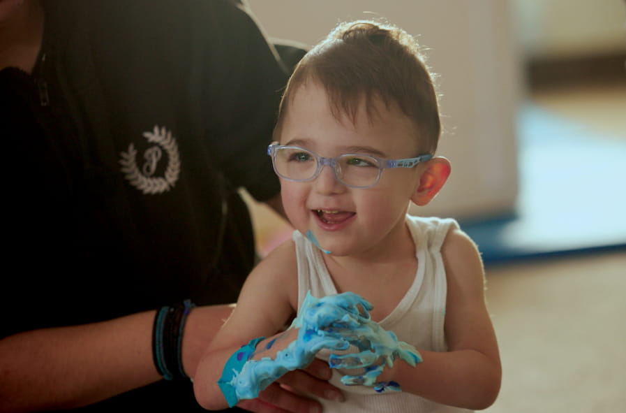 a child with a disability painting
