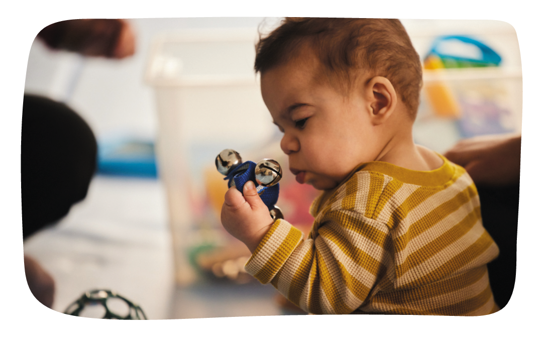 child with disability playing with sensory toy