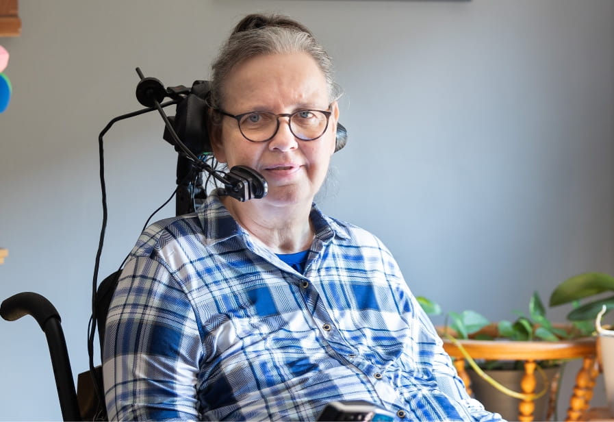 a quadriplegic woman wearing a headset