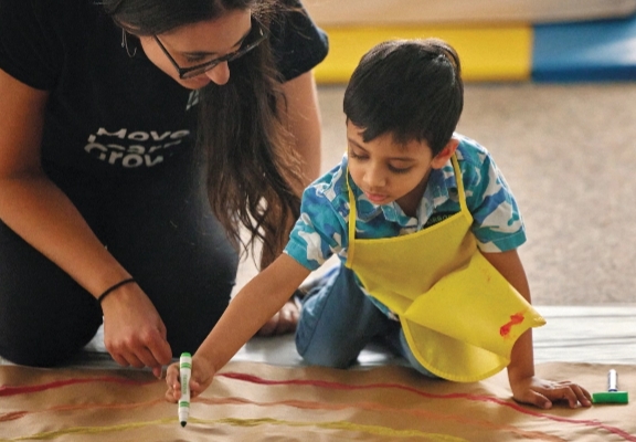 a child with a disability painting